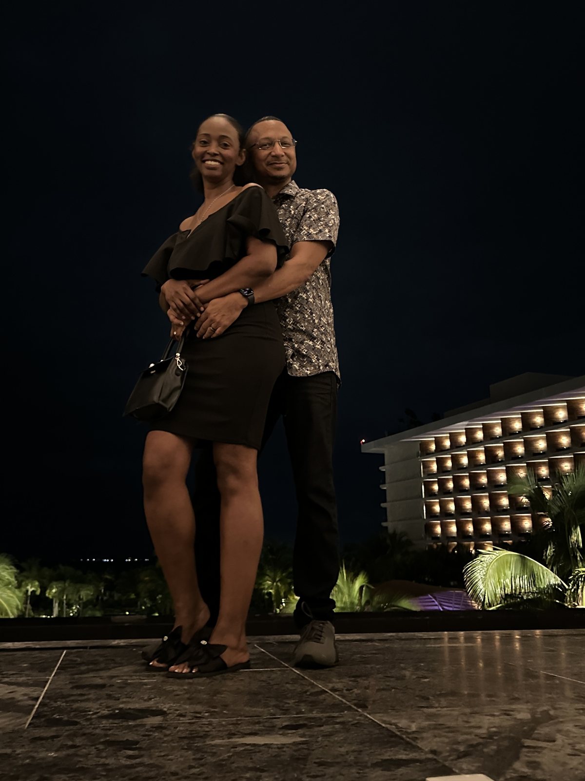 Herman and Rontunya at night outside a hotel