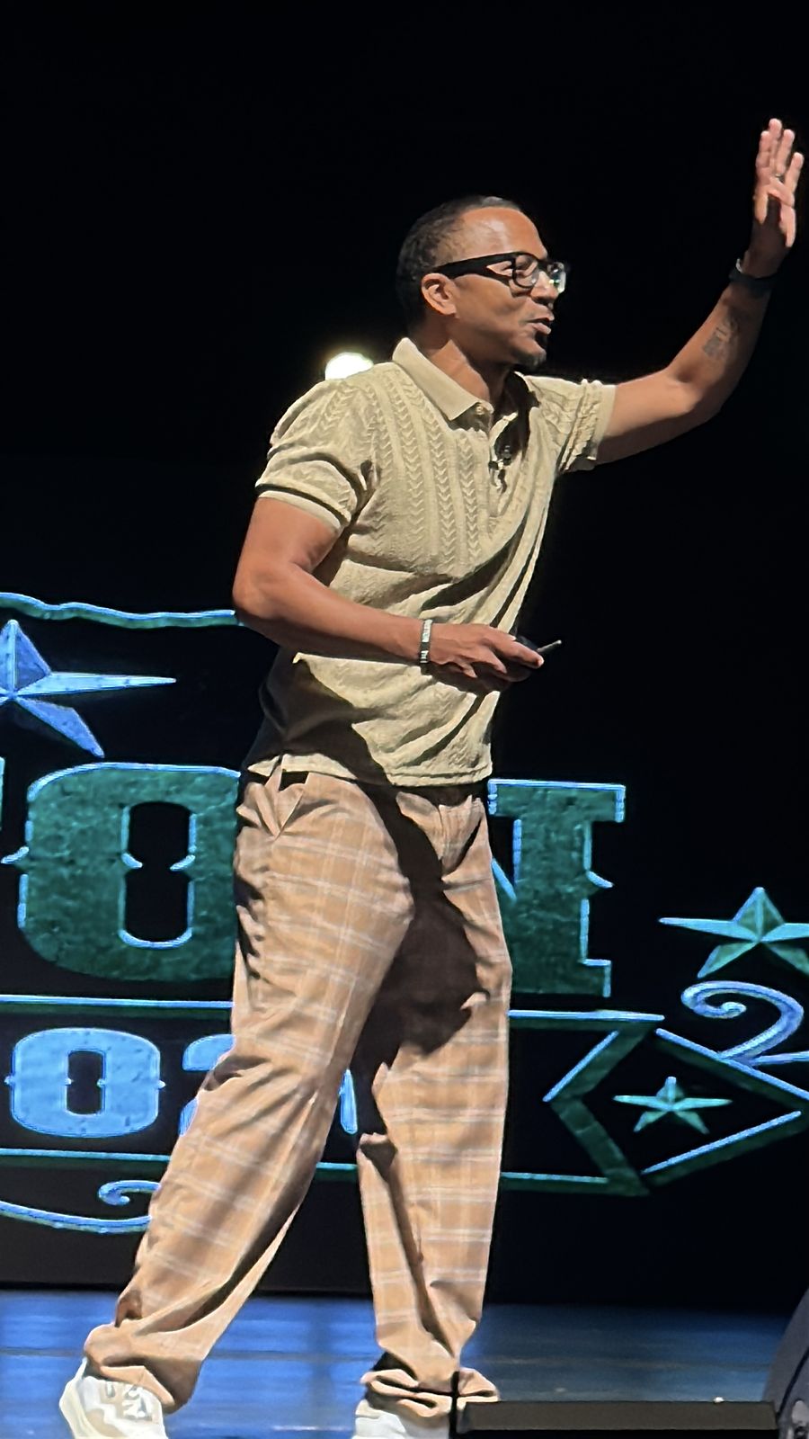 Herman speaking from the side of the stage