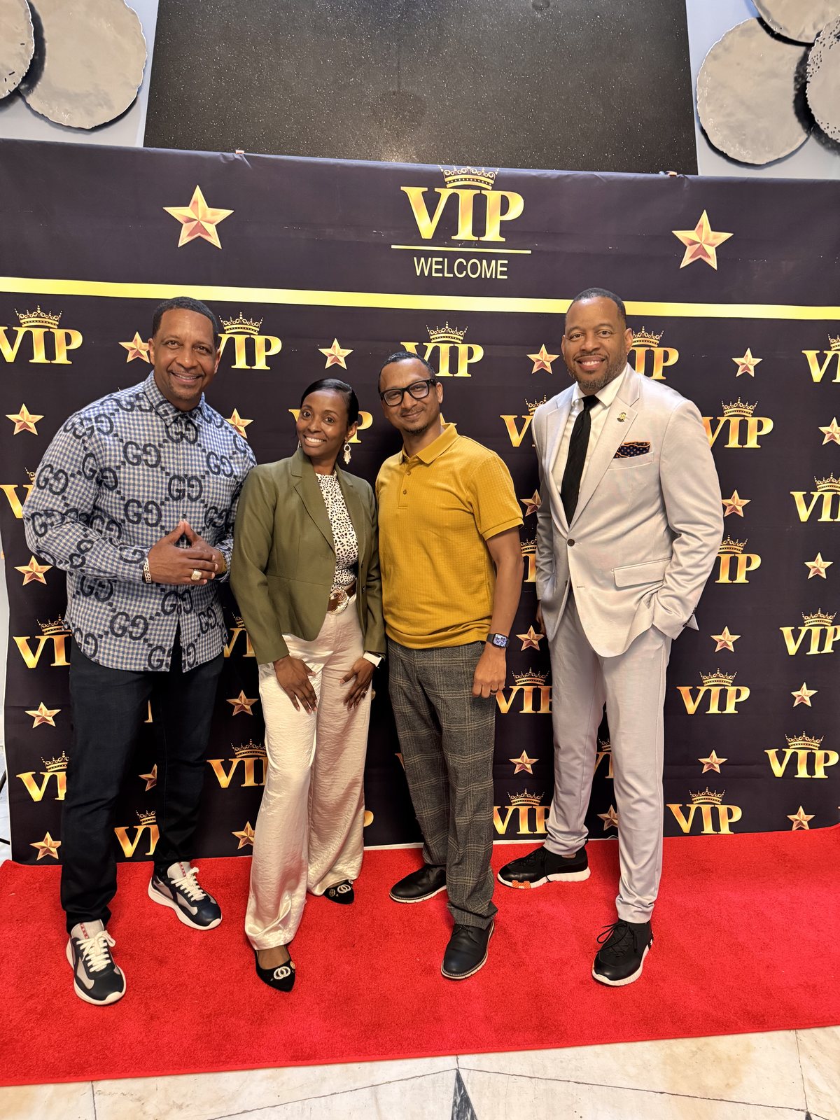 Herman and Rontunya with friends on a VIP red carpet